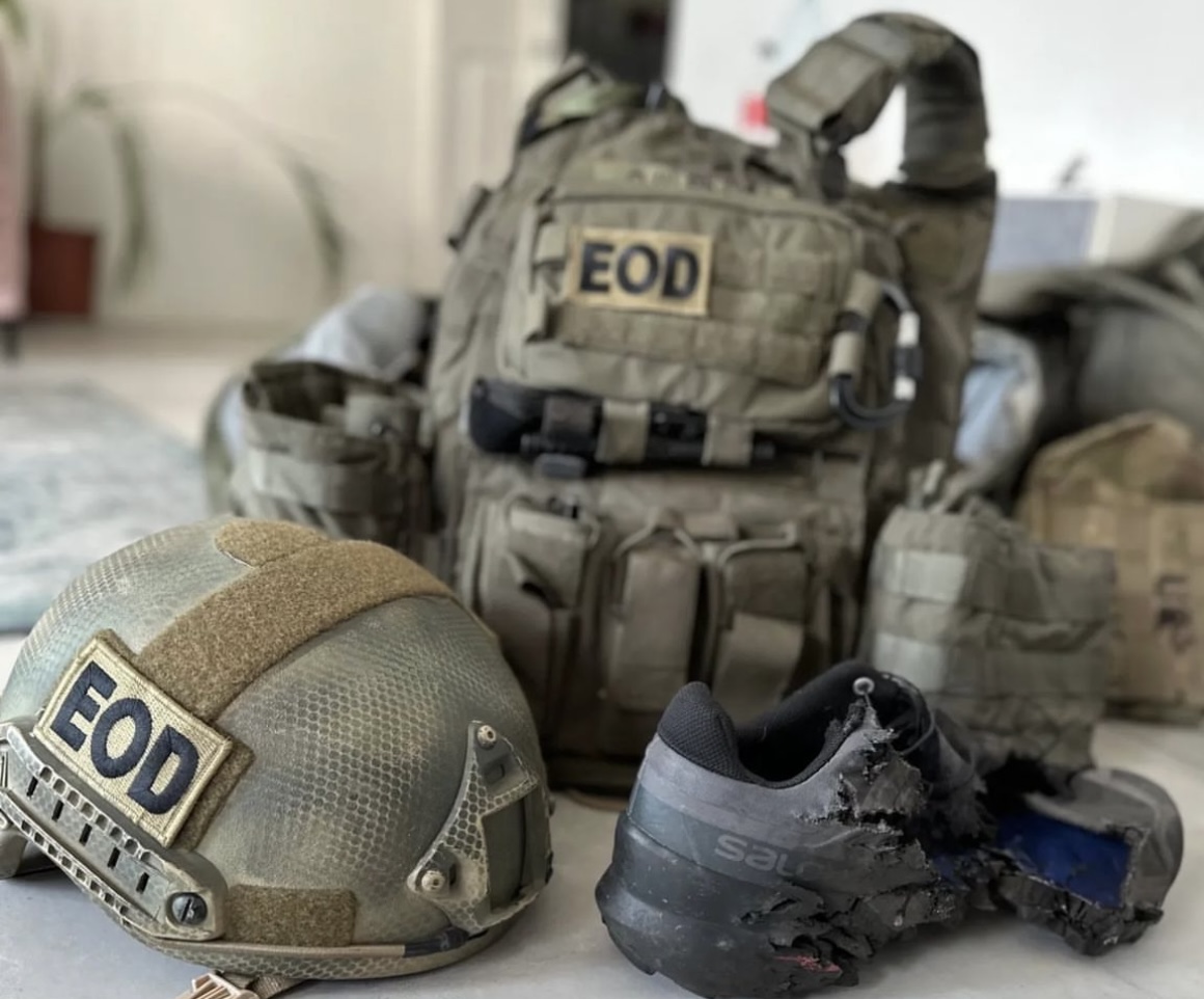 Monty’s EOD helmet, body armor, and damaged footwear following the landmine incident