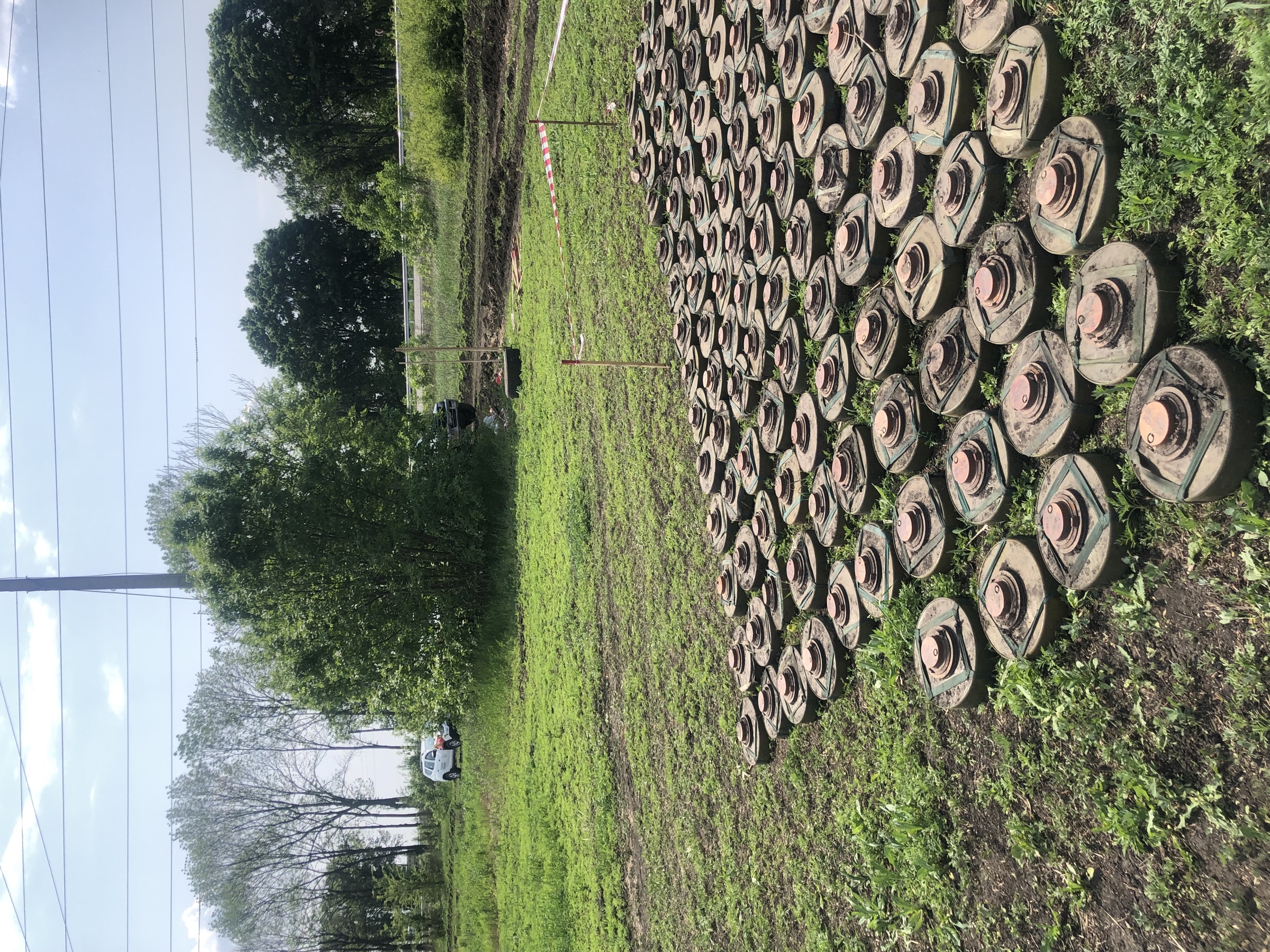 Recovered landmines arranged at a field site in Ukraine
